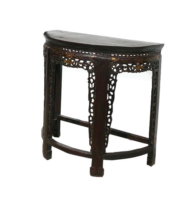 description this half table has ancient style dragon and bat motifs 