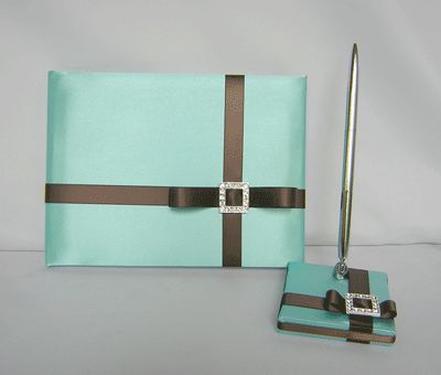 IS COVERED WITH TIFFANY BLUE SATIN FABRIC AND DECORATED WITH CHOCOLATE 